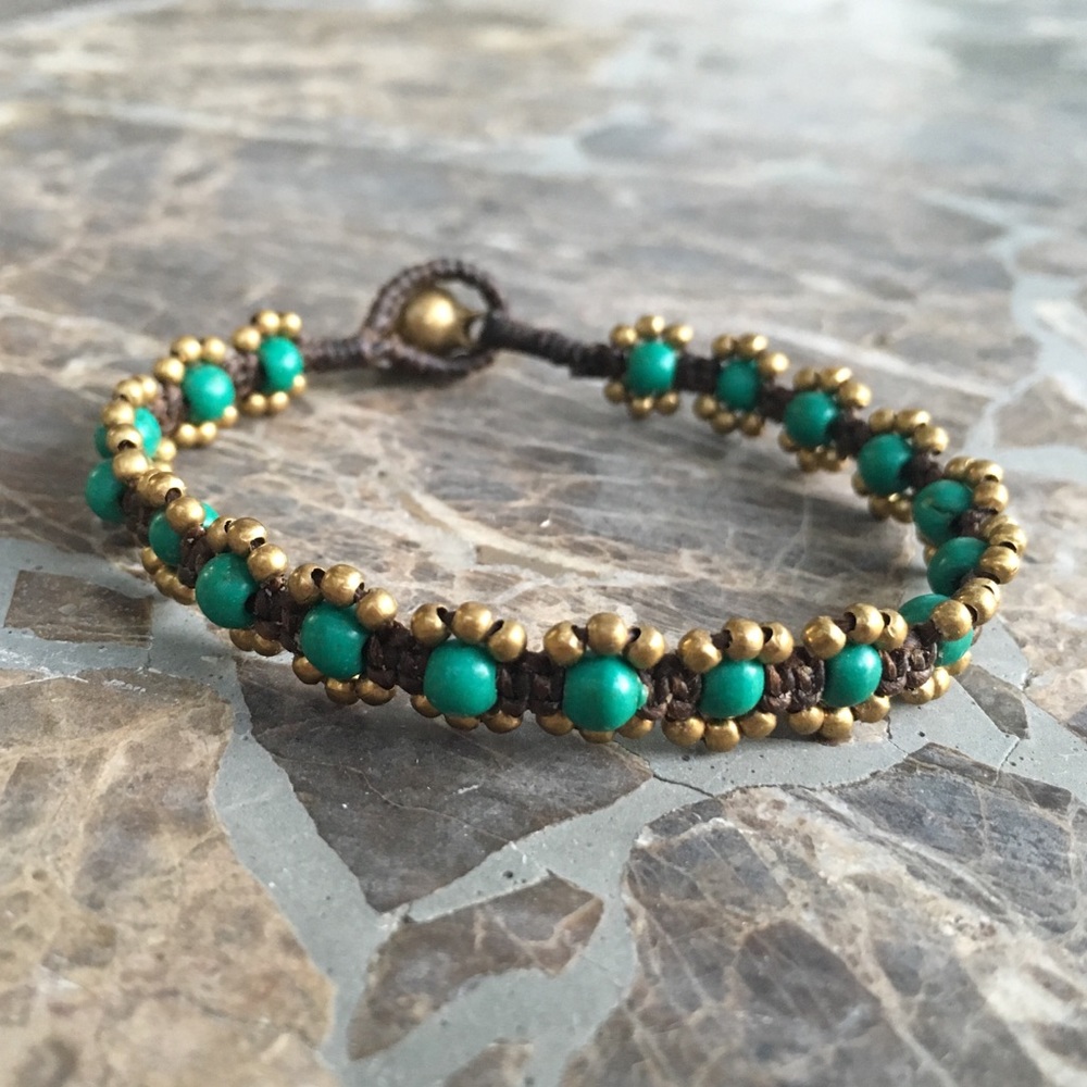 Hand woven beaded boho bracelet with brass bell